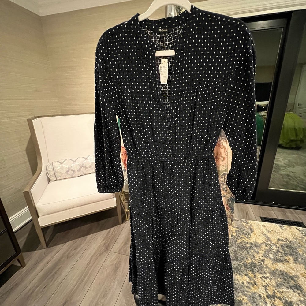 Dark blue long dress with long sleeves. Small white cross pattern